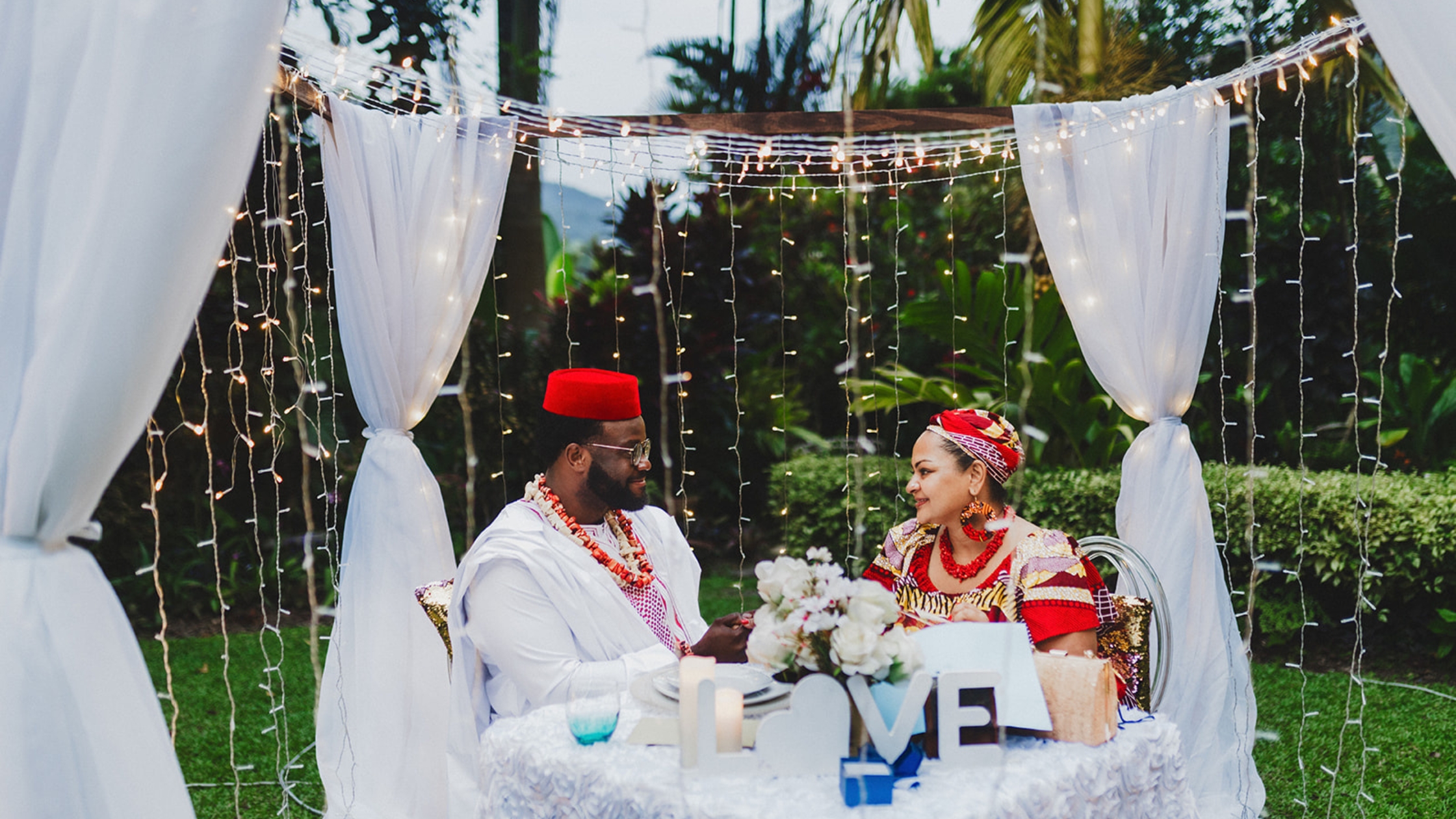 Couple asking would you rather questions during candlelight dinner